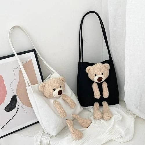 Cute shoulder bags in black and white with plush teddy bear design and long straps
