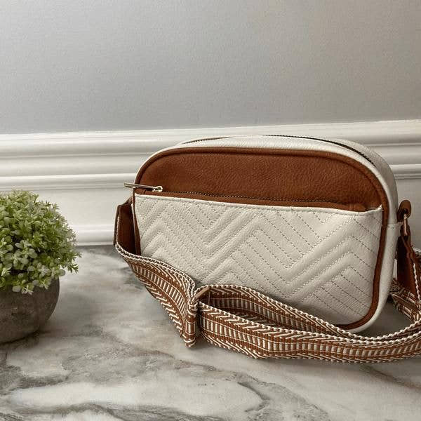 Women crossbody sling bag with stylish wide strap and quilted design in brown and white colors