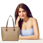 Sophisticated Sherry Monoprint Tote with elegant monoprint design and brown handles displayed with a smiling woman in a light blue top