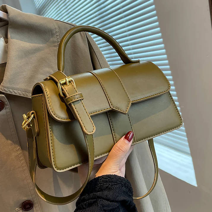 Stylish olive green women bag with adjustable strap and top handle, perfect for daily commute and versatile outfits