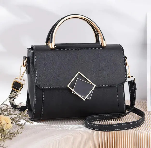 Black oblique cross women bag with gold handle and adjustable strap, synthetic leather crossbody purse