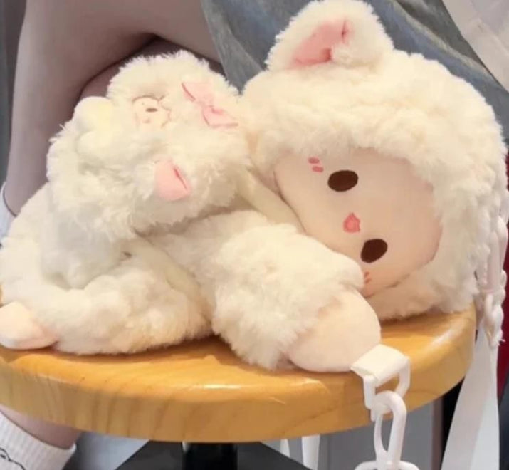 Small cream Cute Lamb Plush Bag with ultra-soft material and zip closure on wooden stool