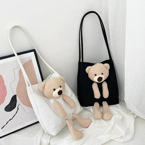 Cute shoulder bags in black and white with plush teddy bear design and long straps