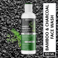ZOZU Charcoal Face Wash 100ml bottle on charcoal background with bamboo, 10x antioxidant deep cleansing foam cleanser.