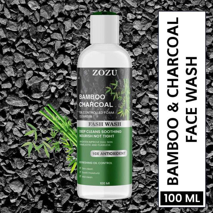 ZOZU Charcoal Face Wash 100ml bottle on charcoal background with bamboo, 10x antioxidant deep cleansing foam cleanser.
