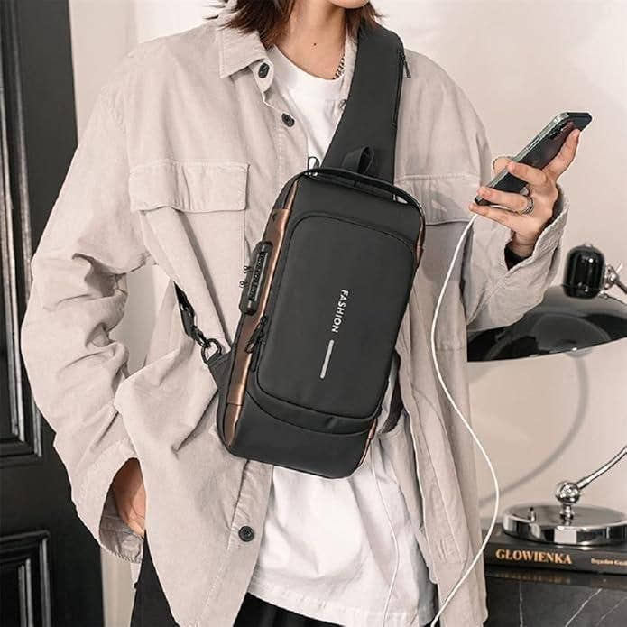 Black leather sling bag for men with zipper closure, worn crossbody style