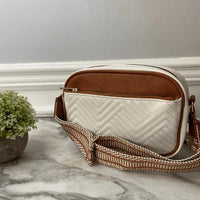 Women crossbody sling bag with stylish wide strap and quilted design in brown and white colors