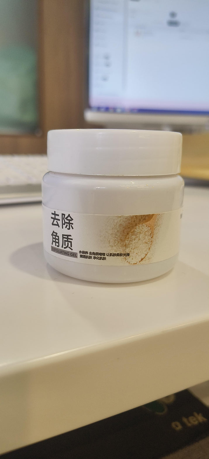 Rice Mild Exfoliating Tan Remover Gel in white jar with natural ingredients label on white surface