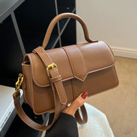 brown stylish women bag with adjustable strap and top handle for daily use
