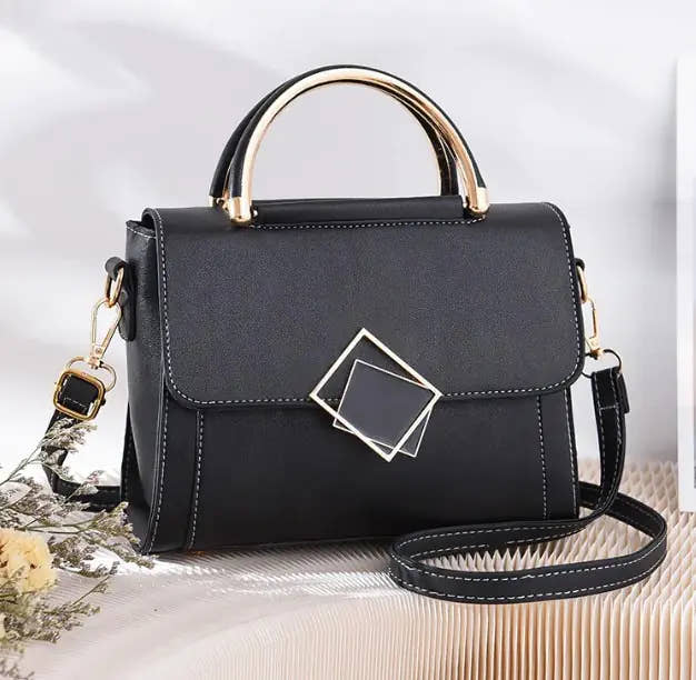 Stylish black oblique cross women bag with gold handle and adjustable strap, synthetic leather material