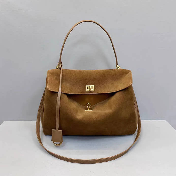 Brown leather crossbody bag for women with horizontal square design and adjustable strap